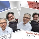 Zwei weiß gerahmte Fotos bilden die sympathischen französischen Künstler Gilles Marie Buscot und Sébastien Dubourg vor der französischen Flagge ab.